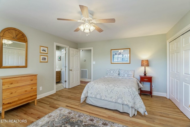 bedroom featuring light wood-style flooring, a closet, baseboards, and visible vents