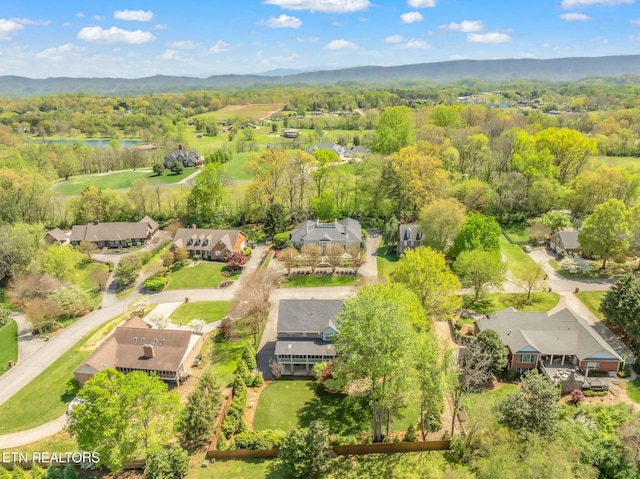 birds eye view of property with a residential view and a view of trees