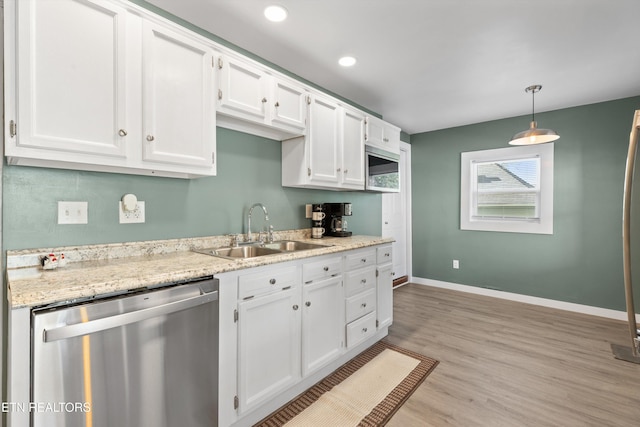 2214 Lincoln St, Knoxville, TN 37920 - kitchen featuring a sink, white cabinets, baseboards, and stainless steel appliances