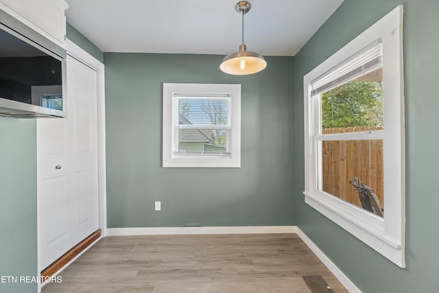 2214 Lincoln St, Knoxville, TN 37920 - unfurnished dining area featuring light wood-style flooring and baseboards