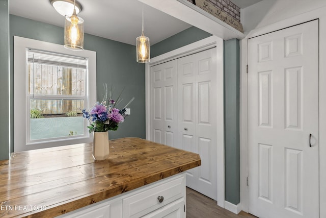 2214 Lincoln St, Knoxville, TN 37920 - kitchen with white cabinets, pendant lighting, and wooden counters