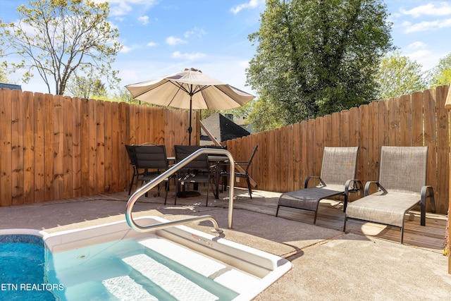 2214 Lincoln St, Knoxville, TN 37920 - view of swimming pool with a patio, fence, and a hot tub