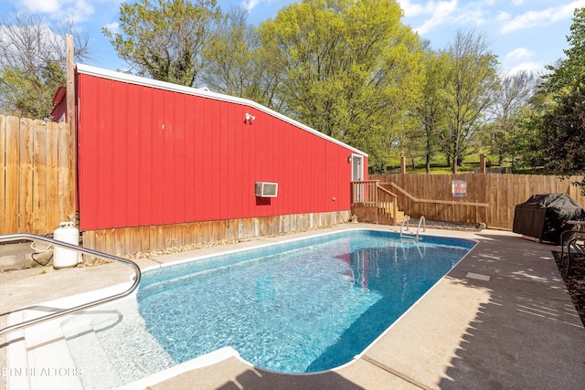 2214 Lincoln St, Knoxville, TN 37920 - view of pool featuring a fenced in pool, a fenced backyard, a wall unit AC, and an outbuilding