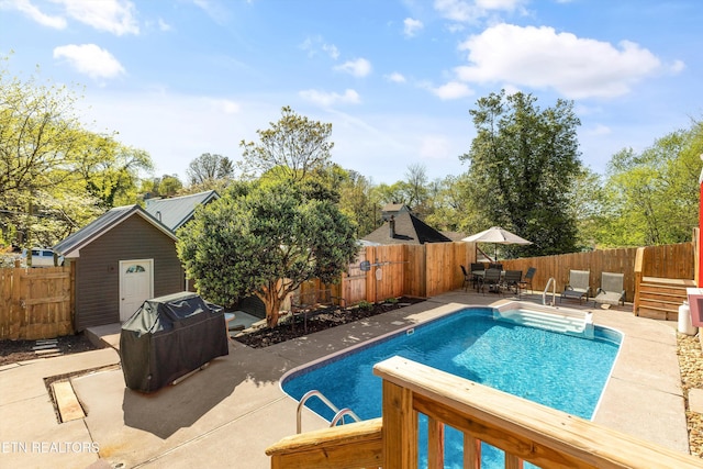 2214 Lincoln St, Knoxville, TN 37920 - view of swimming pool featuring a patio area, a fenced backyard, grilling area, outdoor dining area, and a fenced in pool