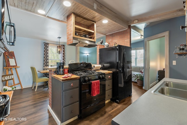 2214 Lincoln St, Knoxville, TN 37920 - kitchen with a sink, range hood, dark wood-style flooring, and black appliances