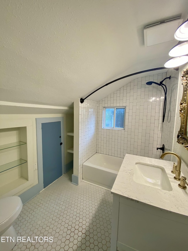 full bath featuring built in shelves, toilet, shower / bathing tub combination, a textured ceiling, and vanity