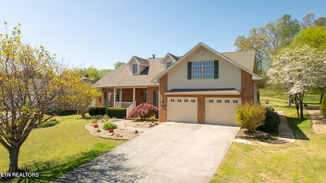 view of front of house with a porch, a garage, brick siding, a front lawn, and driveway