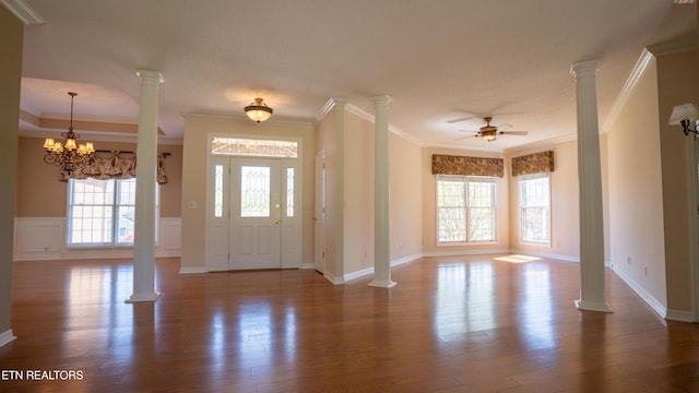 entrance foyer featuring decorative columns, a ceiling fan, and wood finished floors