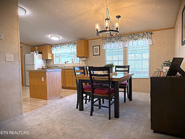 dining space with a chandelier, crown molding, light carpet, and a textured ceiling