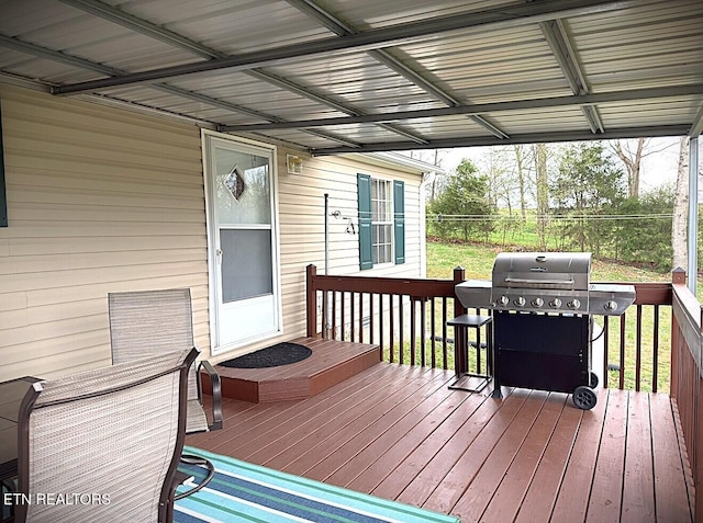 wooden terrace with grilling area and fence