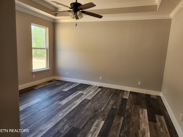 180 W Park Cir, Decatur, TN 37322 - unfurnished room featuring baseboards, ornamental molding, a ceiling fan, a tray ceiling, and dark wood-type flooring