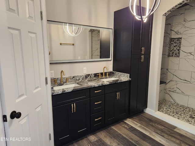 180 W Park Cir, Decatur, TN 37322 - bathroom featuring double vanity, wood finished floors, a marble finish shower, and a sink