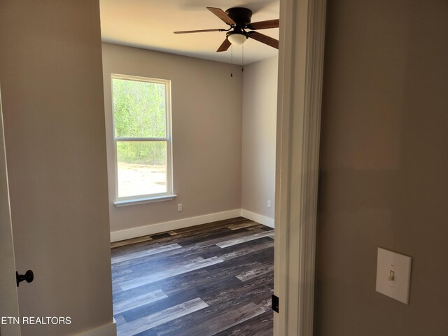 180 W Park Cir, Decatur, TN 37322 - empty room with a ceiling fan, baseboards, and dark wood-style floors