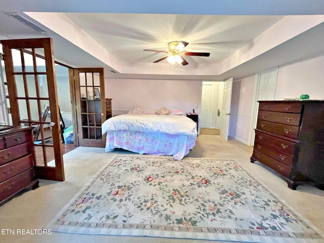 130 Hillview Rd, Ten Mile, TN 37880 - carpeted bedroom with french doors, a tray ceiling, and a ceiling fan