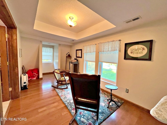 130 Hillview Rd, Ten Mile, TN 37880 - living room with a raised ceiling, baseboards, visible vents, and light wood-style flooring