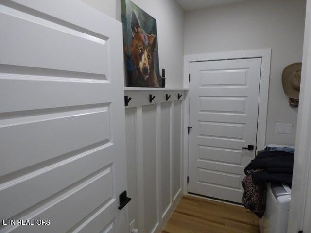 doorway with wood finished floors