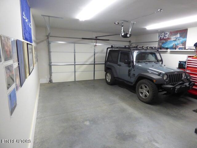 garage featuring a garage door opener