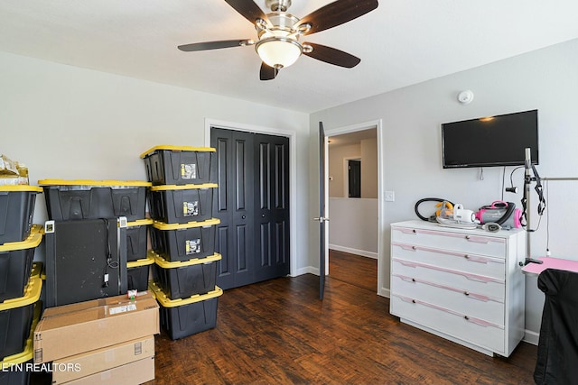 interior space with ceiling fan, baseboards, and wood finished floors