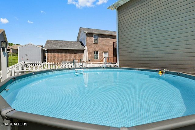 view of pool featuring a wooden deck