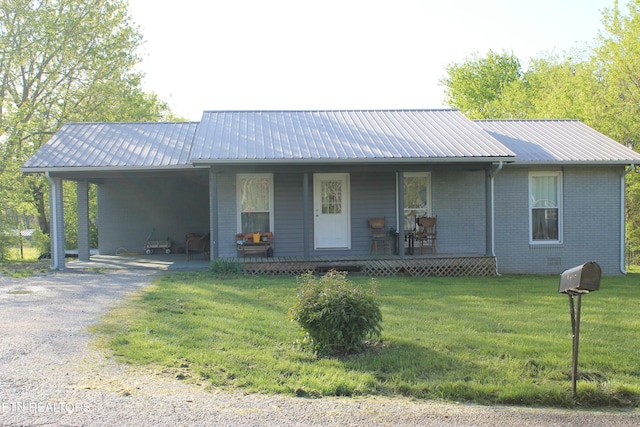 1016 W W Hill Rd, Jamestown, TN 38556 - ranch-style home with brick siding, driveway, a front lawn, and metal roof