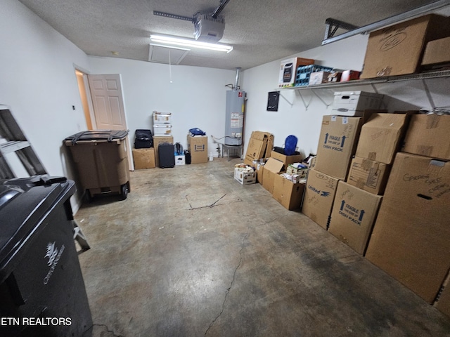 garage with water heater and a garage door opener