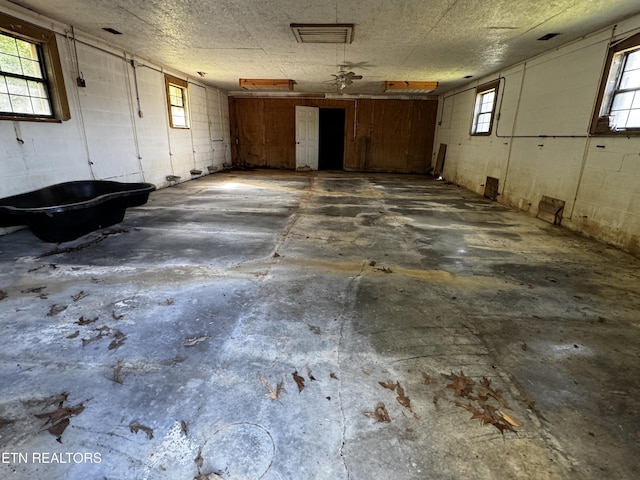 garage with concrete block wall
