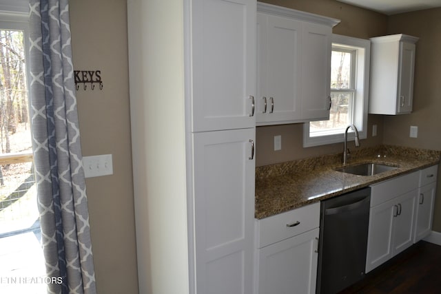 1382 Pilgrim Dr, Grimsley, TN 38565 - kitchen with white cabinets, dishwashing machine, a sink, and dark stone countertops