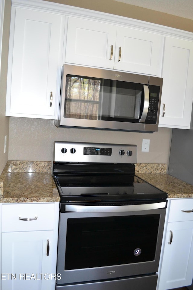 1382 Pilgrim Dr, Grimsley, TN 38565 - kitchen with white cabinets, appliances with stainless steel finishes, and light stone counters