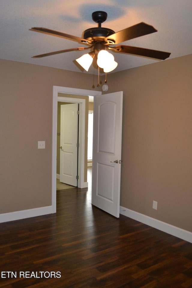1382 Pilgrim Dr, Grimsley, TN 38565 - spare room featuring dark wood-style flooring, baseboards, and a ceiling fan