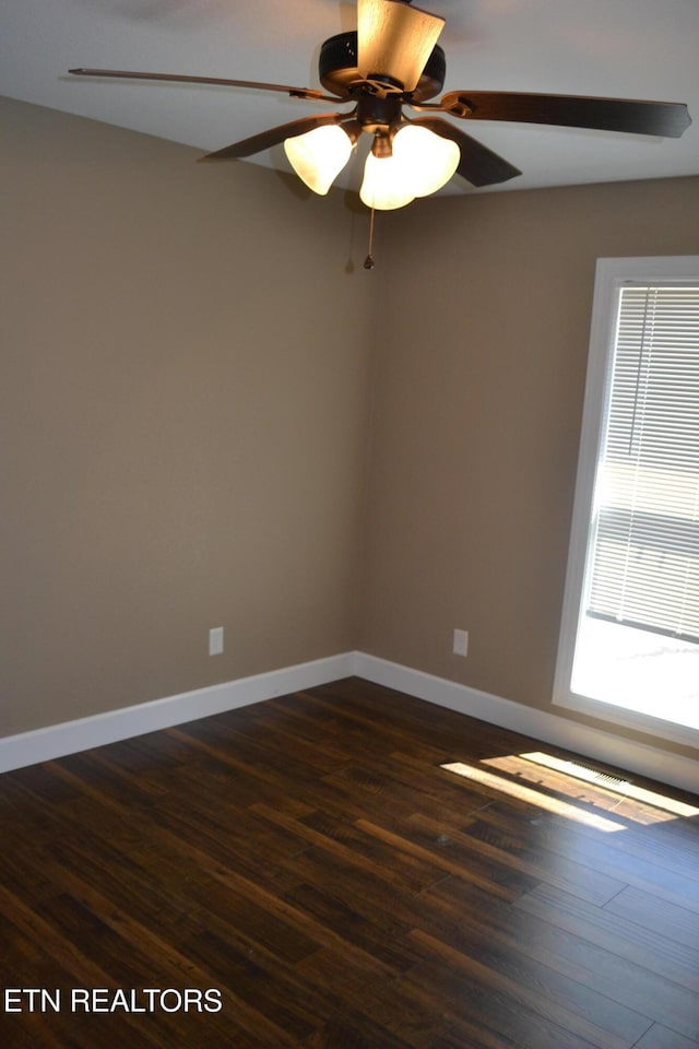 1382 Pilgrim Dr, Grimsley, TN 38565 - spare room featuring dark wood-type flooring, baseboards, and ceiling fan