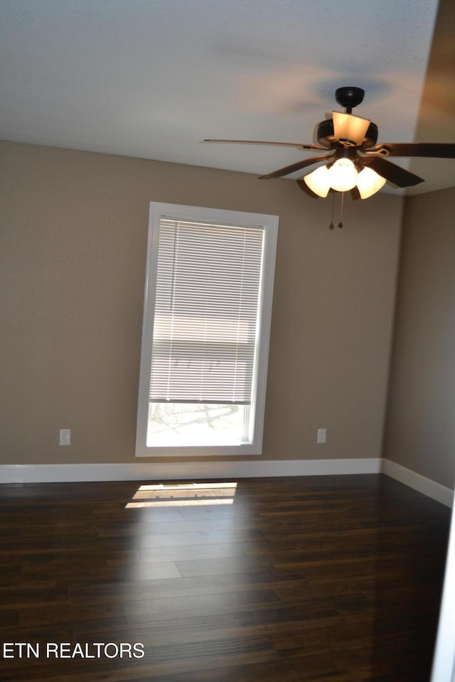 1382 Pilgrim Dr, Grimsley, TN 38565 - spare room with dark wood-type flooring, baseboards, and a ceiling fan