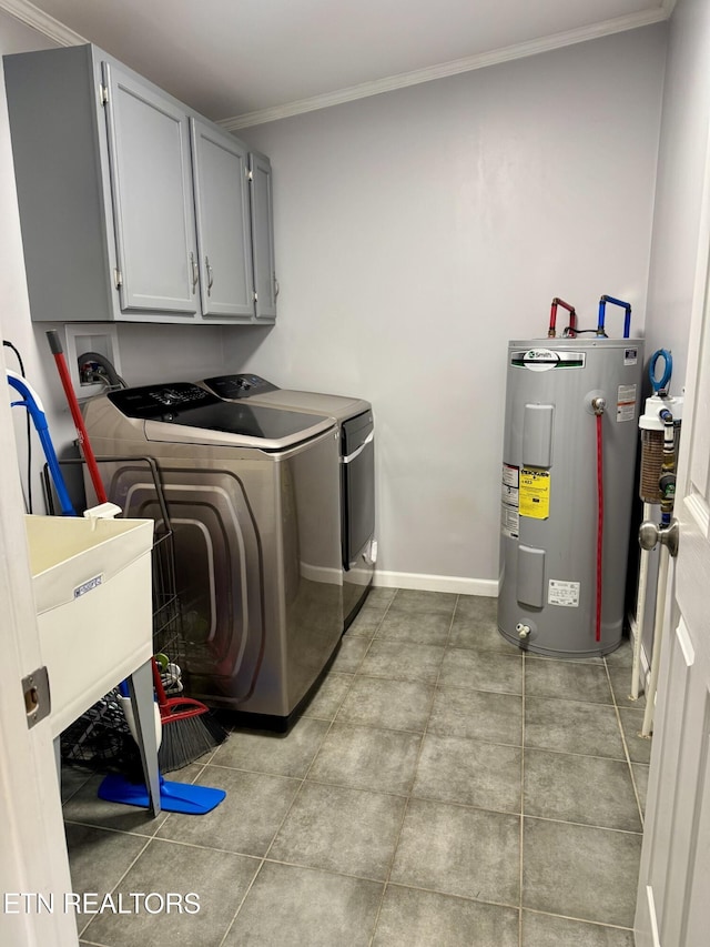 laundry room with a sink, washing machine and dryer, crown molding, cabinet space, and electric water heater