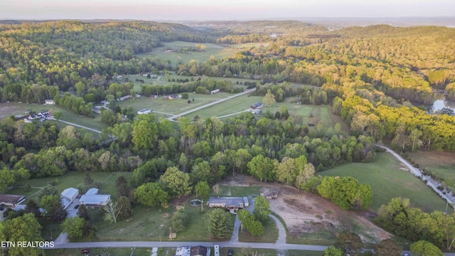 drone / aerial view featuring a view of trees
