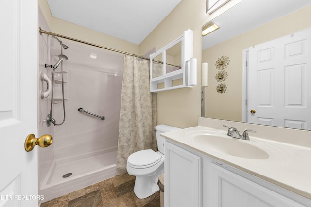 full bathroom featuring toilet, stone finish floor, curtained shower, and vanity