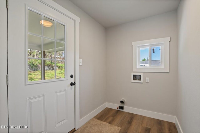 washroom featuring laundry area, baseboards, washer hookup, and dark wood finished floors