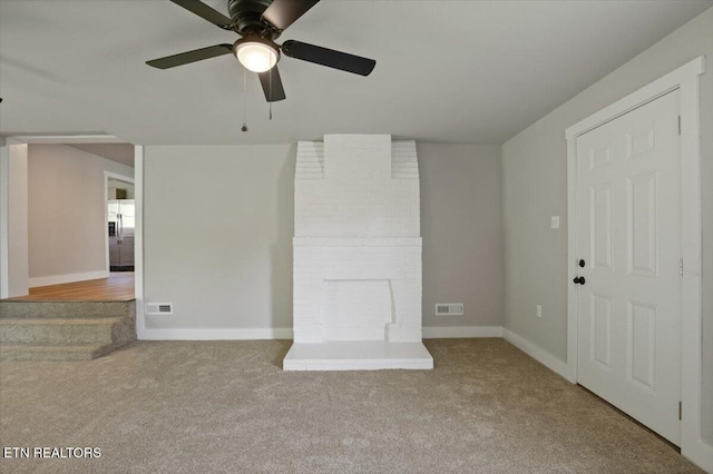 unfurnished living room featuring ceiling fan, baseboards, visible vents, and carpet floors