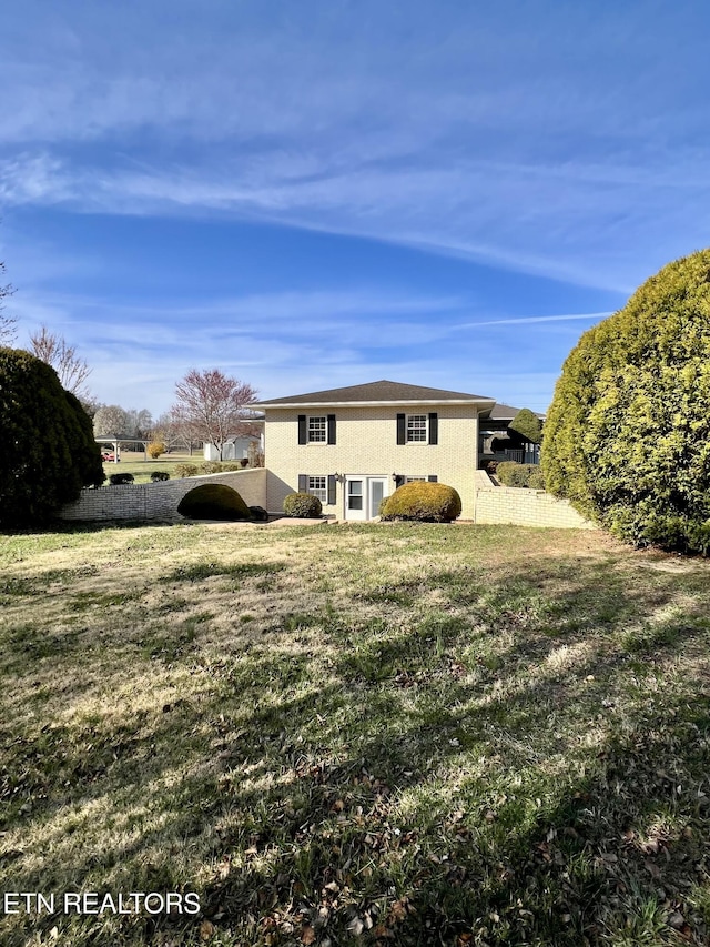view of home's exterior with a yard and stucco siding