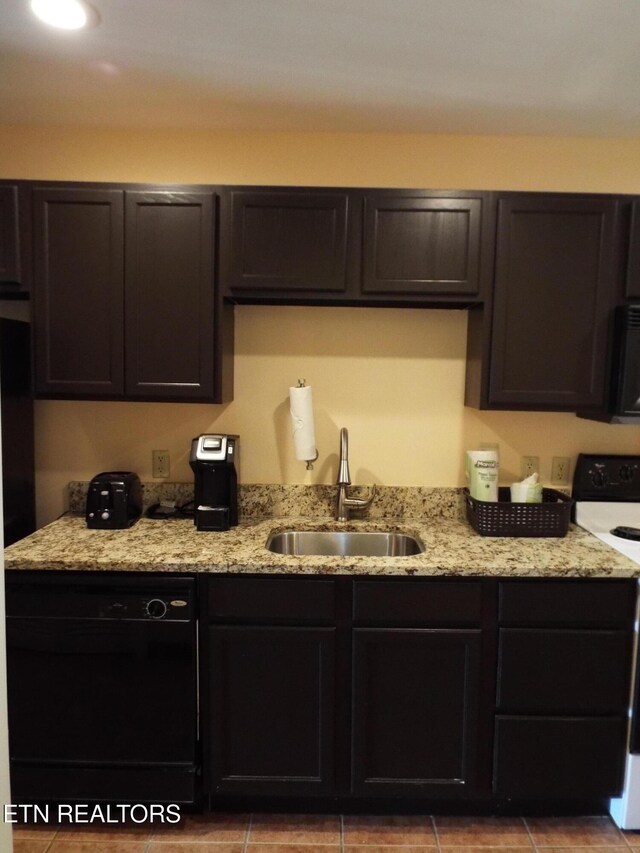 225 Collier Dr, Sevierville, TN 37862 - kitchen featuring light stone countertops, black dishwasher, a sink, range with electric cooktop, and tile patterned floors