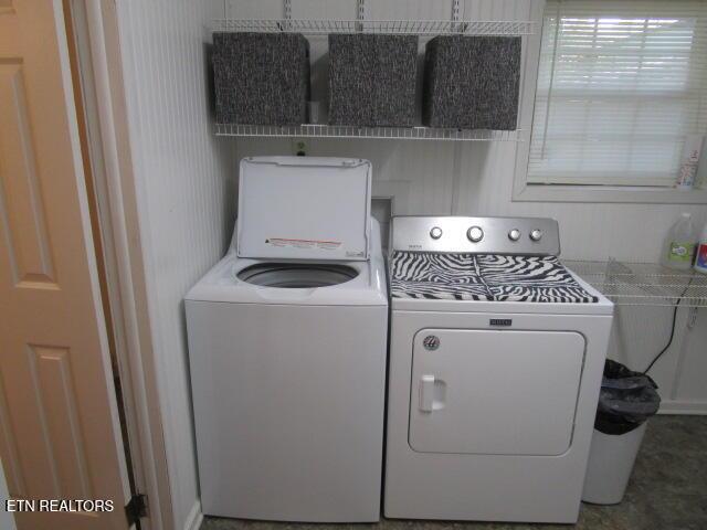 washroom with laundry area and separate washer and dryer