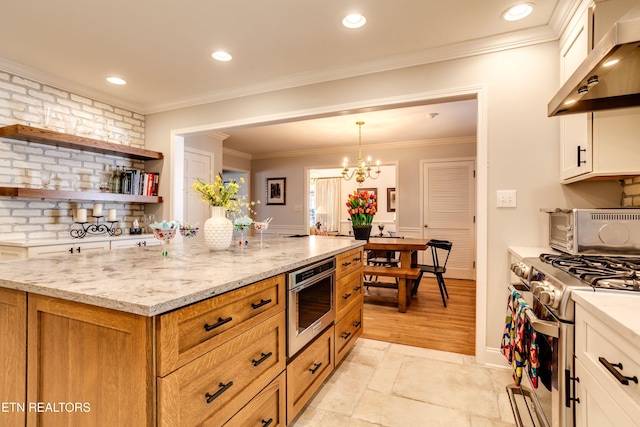 3835 SW Keowee Ave, Knoxville, TN 37919 - kitchen featuring open shelves, wall chimney range hood, white cabinetry, stainless steel gas range oven, and light stone counters