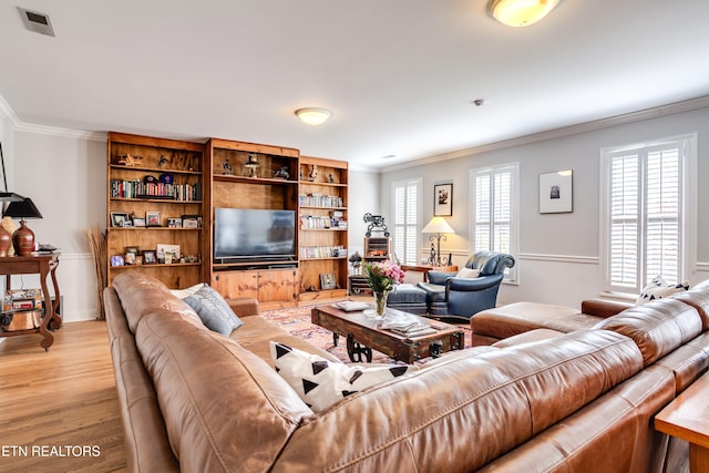 3835 SW Keowee Ave, Knoxville, TN 37919 - living room featuring light wood finished floors, baseboards, and ornamental molding