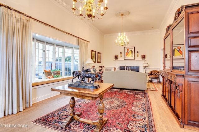 3835 SW Keowee Ave, Knoxville, TN 37919 - living room with ornamental molding, light wood finished floors, and a notable chandelier