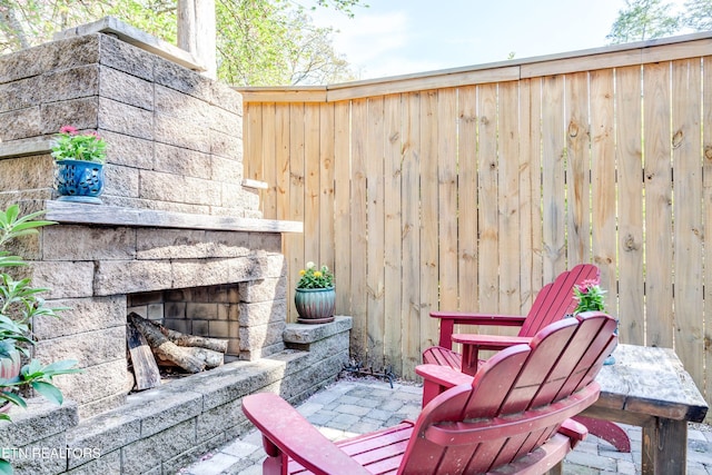 3835 SW Keowee Ave, Knoxville, TN 37919 - view of patio with a stone fireplace