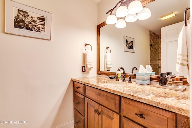 3835 SW Keowee Ave, Knoxville, TN 37919 - full bath featuring a tile shower, vanity, and an inviting chandelier