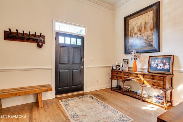 3835 SW Keowee Ave, Knoxville, TN 37919 - foyer entrance featuring ornamental molding, baseboards, and wood finished floors