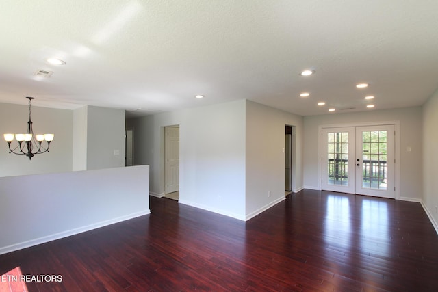 unfurnished room with visible vents, baseboards, a chandelier, dark wood-style floors, and recessed lighting