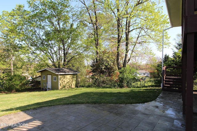 view of patio / terrace with an outbuilding