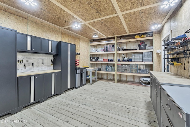 kitchen with light wood-type flooring and light countertops