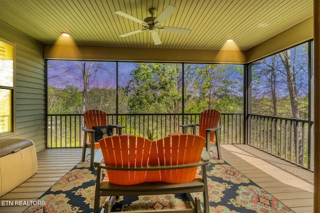 sunroom / solarium with ceiling fan