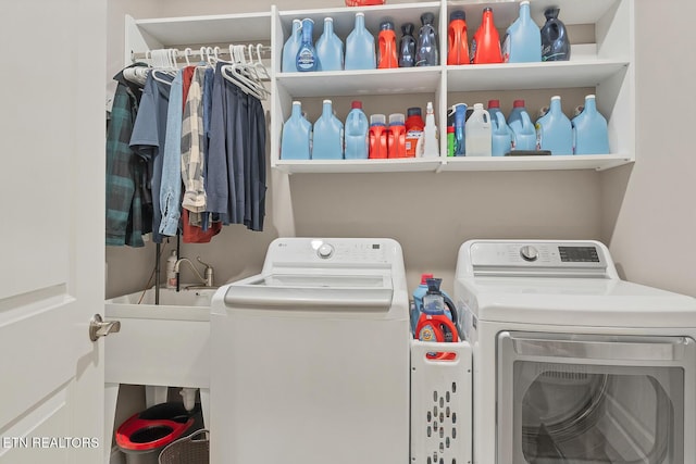 clothes washing area with laundry area and washing machine and clothes dryer